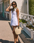 Woven sleeveless dress. Drop waist. Bubble skirt. Side hook and eye and zipper closures. Adjustable lace up back closure. Fully lined. white mini bubble skirt. summer dress. vacation dress. vacation outfit. nice dress. european summer dress. european summer outfit. european summer vacation