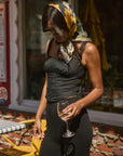 Woven crop top. Fixed straps. Front hook and eye closures. Lace trim. Side zipper closure. Fully lined. blank tank top. black crop top tank top. top that hooks in the front. black corset top. going out top. european summer outfit. european summer top. vaction outfit.