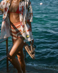 Striped knit shorts. Elastic waistband. Unlined. orange and white stripe shorts. summer shorts. beach cover up. beach short cover up. mexico outfit inspo. beach vacation outfit. european summer shorts. european summer outfit. summer vacation outfit. vacation outfit. shorts to wear on vacation