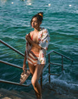Striped knit shorts. Elastic waistband. Unlined. orange and white stripe shorts. summer shorts. beach cover up. beach short cover up. mexico outfit inspo. beach vacation outfit. european summer shorts. european summer outfit. summer vacation outfit. vacation outfit. shorts to wear on vacation