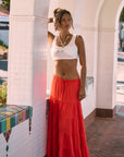 Woven tiered midi skirt. Elastic waist with drawstring closure. Partially lined. red maxi skirt. red midi skirt. red ruffle skirt. red flowy skirt. beach cover up. beach skirt cover up. beach vacation outfit. summer vacation skirt. european summer skirt. european summer outfit. european summer inspo