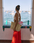 Woven tiered midi skirt. Elastic waist with drawstring closure. Partially lined. red maxi skirt. red midi skirt. red ruffle skirt. red flowy skirt. beach cover up. beach skirt cover up. beach vacation outfit. summer vacation skirt. european summer skirt. european summer outfit. european summer inspo