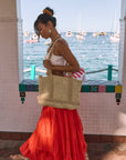 Woven tiered midi skirt. Elastic waist with drawstring closure. Partially lined. red maxi skirt. red midi skirt. red ruffle skirt. red flowy skirt. beach cover up. beach skirt cover up. beach vacation outfit. summer vacation skirt. european summer skirt. european summer outfit. european summer inspo