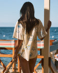 Printed woven shirt. Collar neckline. Short sleeves. Front button down closures. Front pocket. Unlined. shirt with wine on it. shirt with lemon. shirt with grapes. beach cover up. beack top cover up. summer top. vacation top. vacation outfit. european summer top. european summer outfit. european summer outfit inspo
