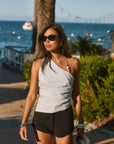 Woven top. Asymmetric neckline. Elastic steps. Beaded details. Ruched side. Side zipper closure. Fully lined. blue tank top. blue asymmetrical tank top. tank top with beads. summer outfit. summer going out top. beach vacation outfit. beach vacation top. fancy dinner top. european summer outfit. european summer top. european summer outfit inspo. vacation outfit