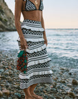 Crochet knit bikini top. Ruffle trim. Adjustable back tie closure. Crochet knit maxi skirt. Elastic waist. Ruffle trim. Unlined. black and white set. black and white skirt set. skirt and crop top set. summer outfit. summer going out set. beach vacation outfit. fancy dinner outfit. european summer outfit. european summer set. european summer outfit inspo. vacation outfit