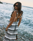 Crochet knit bikini top. Ruffle trim. Adjustable back tie closure. Crochet knit maxi skirt. Elastic waist. Ruffle trim. Unlined. black and white set. black and white skirt set. skirt and crop top set. summer outfit. summer going out set. beach vacation outfit. fancy dinner outfit. european summer outfit. european summer set. european summer outfit inspo. vacation outfit