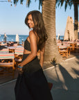 Ruched woven crop top. Adjustable straps. Side zipper closure. Elastic smocked back. Fully lined. black cropped tank top. summer outfit. summer going out top. beach vacation outfit. beach vacation top. fancy dinner top. european summer outfit. european summer top. european summer outfit inspo. vacation outfit. black skirt and cropped tank set