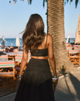 Ruched woven crop top. Adjustable straps. Side zipper closure. Elastic smocked back. Fully lined. black cropped tank top. summer outfit. summer going out top. beach vacation outfit. beach vacation top. fancy dinner top. european summer outfit. european summer top. european summer outfit inspo. vacation outfit. black skirt and cropped tank set