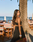 Ruched woven crop top. Adjustable straps. Side zipper closure. Elastic smocked back. Fully lined. black cropped tank top. summer outfit. summer going out top. beach vacation outfit. beach vacation top. fancy dinner top. european summer outfit. european summer top. european summer outfit inspo. vacation outfit. black skirt and cropped tank set