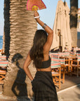 Ruched woven crop top. Adjustable straps. Side zipper closure. Elastic smocked back. Fully lined. black cropped tank top. summer outfit. summer going out top. beach vacation outfit. beach vacation top. fancy dinner top. european summer outfit. european summer top. european summer outfit inspo. vacation outfit. black skirt and cropped tank set