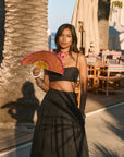 Ruched woven crop top. Adjustable straps. Side zipper closure. Elastic smocked back. Fully lined. black cropped tank top. summer outfit. summer going out top. beach vacation outfit. beach vacation top. fancy dinner top. european summer outfit. european summer top. european summer outfit inspo. vacation outfit. black skirt and cropped tank set