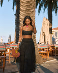 Ruched woven crop top. Adjustable straps. Side zipper closure. Elastic smocked back. Fully lined. black cropped tank top. summer outfit. summer going out top. beach vacation outfit. beach vacation top. fancy dinner top. european summer outfit. european summer top. european summer outfit inspo. vacation outfit. black skirt and cropped tank set