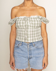 green Woven plaid top
Faux front button
Adjustable front tie
Lace bust trim detail
Smocked shoulder sleeves and back
Side zipper
Unlined
summer top
spring top