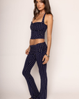 navy and white polka dot halter top with adjustable neck tie
navy and white fold over stretchy pants