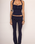 navy and white polka dot halter top with adjustable neck tie
navy and white fold over stretchy pants