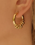 18K Gold Non-Tarnish Hoop Earrings
18K Gold Plating
Stainless Steel
Measurement (L x W inch): 1.12 x 0.97
Lead-free
Nickel-safe
Hypoallergenic
Water Resistant