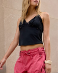 black V neck line halter top
Adorned with lace details
Adjustable tie closure at the back