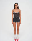 Floral printed woven cropped tank top. Adjustable straps. Boning in bodice. Elastic back strap with hook and eye closures. Back zipper closure. Fully lined.