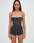 Floral printed woven cropped tank top. Adjustable straps. Boning in bodice. Elastic back strap with hook and eye closures. Back zipper closure. Fully lined.