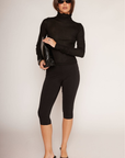 black Thin knit top
Turtleneck
Long sleeves
Unlined
black sheer long sleeve top