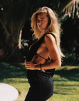 Cut from lightweight Lyocell Tissue Jersey
Deep cowl halter neckline
Reversible silhouette that can be worn front to back or back to front
Doubled skirt smooths
Adjustable length lets you wear her shorter or longer
Seamless, flattering
black mini dress with deep cowl neckline
Length: 31.5"