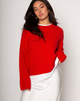 Medium weight knit sweater. Crewneck. Long sleeves. Thin ribbed trim detail at collar, sleeve cuffs, and hemline. Unlined. Pullover style. red pullover sweater. valentines day outfit