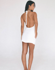 Woven dress. Adjustable halter tie neckline. Low scoop neckline. Fully lined. white mini dress. Deep v dress. low neck line dress. open back dress. open back mini dress