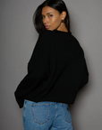 Fuzzy knit cardigan. Crewneck. Front button down closures. Long sleeves. Unlined. black cardigan. fall outfit. fall cardigan. layering piece. layering cardigan