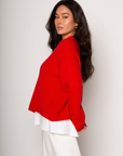 Medium weight knit sweater. Crewneck. Long sleeves. Thin ribbed trim detail at collar, sleeve cuffs, and hemline. Unlined. Pullover style. red pullover sweater. valentines day outfit