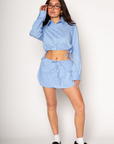 Striped woven skort. Elastic waistband with drawstring closure. Faux front button down closures. Shorts lining. blue stripe skort. blue stripe top skort