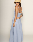 Woman wearing a blue checkered dress and straw hat on a beige backgroundBlue and white Checkered vintage maxi dress
V-neck neckline
Front button down closure
Adjustable straps
Lace trim and hem
Smocked back
Lined
Country side maxi dress
european summer dress