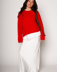 Medium weight knit sweater. Crewneck. Long sleeves. Thin ribbed trim detail at collar, sleeve cuffs, and hemline. Unlined. Pullover style. red pullover sweater. valentines day outfit