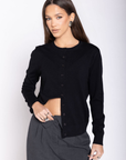 Knit long sleeve cardigan
Front button down closure
Ribbed crewneck neckline
Unlined
black cardigan