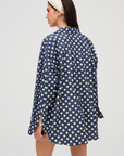 Denim polka dot button-down long sleeve top
Collared
Functional buttons at cuff
Pleat at center-back from waist to hem
Unlined
Cotton
