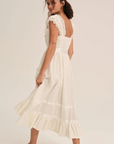Cotton midi dress
Includes a romper liner
Center-front button closure
Lace trims
Satin ribbon details
white ivory summer mini dress
countryside midi dress
bridal midi dress