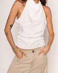 white Cowl neck halter top
Pleated sides
Adjustable neck tie
Low back
Back zipper closure
Unlined