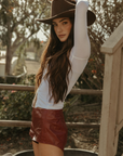 Faux leather shorts. Back hook and eye and zipper closures. Fully lined. red leather shorts. red hot shorts. mini red leather shorts.