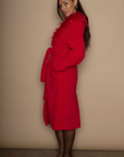 Faux sherpa longline coat. Faux fur collar neckline. Front snap button closure. Tie waist. Side pockets. Back slit. Fully lined. red fur coat. fall outfit. cute winter coat. trendy winter coat.
