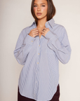 blue and white Striped oversized button down shirt
Collared
Front chest pocket
Long sleeve
Button down closure
Unlined