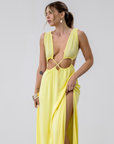 Crinkle woven sleeveless maxi dress. Waist cut outs. Side slits. Back tie closure. Back drawstring waist closure. Partially lined. vacation dress. beach dress. yellow maxi dress.