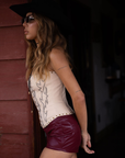 Embroidered knit corset
Adjustable halter tie neck
Front lace up closure
Back hook and eye and zipper closures
Fully lined
Studded details
Coachella outfit
Stagecoach outfit
Festival Outfit