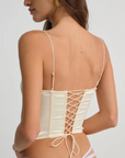 cream Sleek satin bustier with lace detailing
Fully boned bodice
Adjustable lace-up back
Skinny tie bow
Rosette adornments
Lined at cups
Adjustable shoulder straps
Polyester/Elastane
cream ligneire bustier top