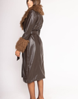 brown Midi-length faux leather coat
Straight silhouette with a wrap front
Belt to cinch the waist
Shearling trims the oversized collar and wide cuffs
Button down closure
Lined
leather coat with fur trim
Aspen vibes