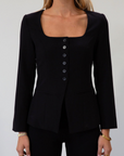 black Woven blazer style top. Long sleeves with faux button closures. Square neckline. Front button down closure. Faux front pockets. Fully lined. black fall top. work top