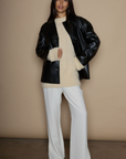 Faux leather blazer. faux leather jacket. Single breast. Collar neckline. Front button down closure. Side pockets. Back slit. Fully lined. black leather jacket. black leather blazer. fall jacket. trendy fall jacket. winter jacket. trendy winter jacket