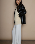 Faux leather blazer. faux leather jacket. Single breast. Collar neckline. Front button down closure. Side pockets. Back slit. Fully lined. black leather jacket. black leather blazer. fall jacket. trendy fall jacket. winter jacket. trendy winter jacket