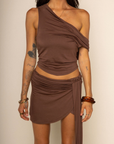 TOP:
Cowl neckline tank top
Back adjustable tie
Back cowl droop
Unlined
BOTTOM:
Mini skirt with side hanging sash
Asymmetrical hemline
Cinched thick waistband
Unlined