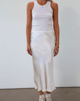 Satin maxi skirt. Elastic waist. Side hook and eye and zipper closures. Unlined. cream maxi skirt. satin maxi skirt. fall outfit.