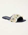 Natural shell-embellished slide sandals
Flat sole
Square toe
Delicate stitching detail